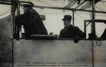 A Bord du Dirigeable 'Ville de Paris'. Le Commandant Bouttieaux assis, M. Kapferer à la direction