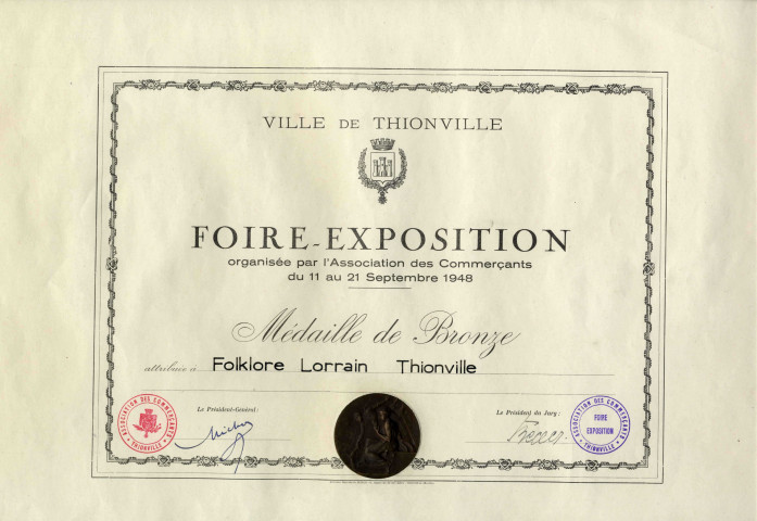 Diplôme attribué au Folklore Lorrain de Thionville lors de la Foire-Exposition organisée par l'Association des Commerçants du 11 au 21 septembre 1948.