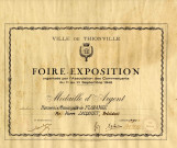 Foire-Exposition organisée par l'Association des commerçants du 11 au 21 septembre 1948. Médaille d'argent attribuée à l'Harmonie de Florange - Mr Pierre JACQUIET, Président.